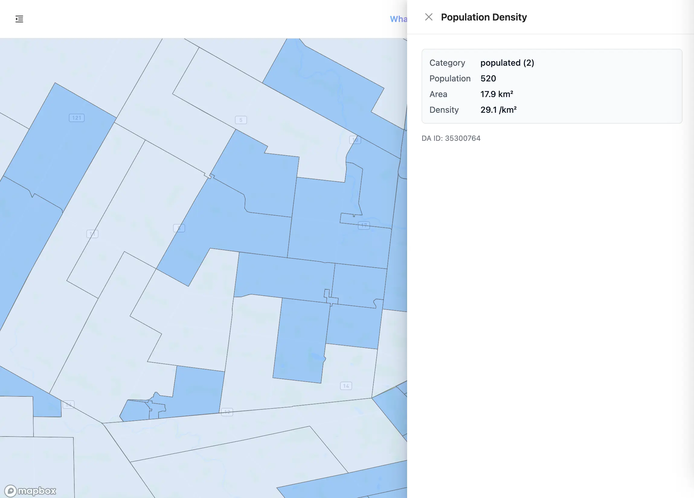 Polygones de densité de population en deux teintes de bleu couvrant une ville et sa campagne environnante